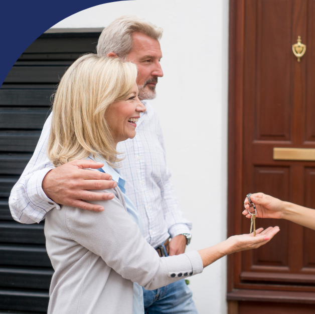 Happy clients receiving keys to their new home with confidence
