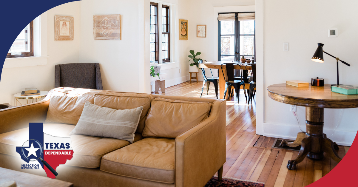 Warm and inviting living and dining area with natural light and wood flooring.
