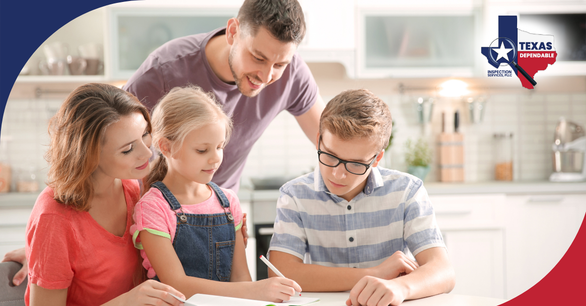 Parents helping their children with homework in a bright kitchen.